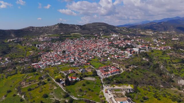 Wide Aerial Orbit High Above Pano Lefkara Village and Scenic Winter Mountains in Cyprus
