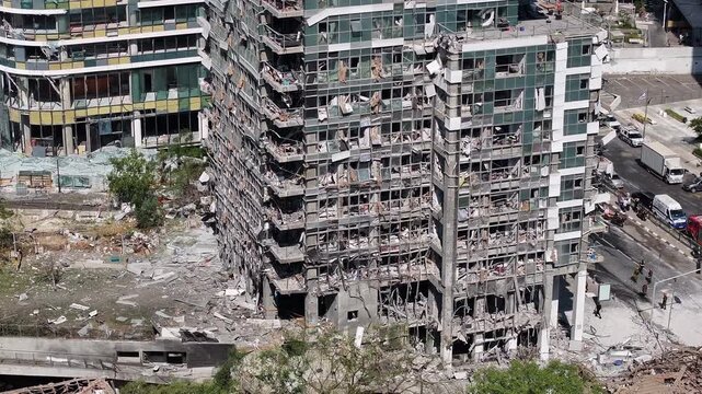 Aerial view Ramat Gan Iranian missile strike destruction Israel

Drone footage showing heavy structural damage from missile impact in Ramat Gan Israel June 13 2025

