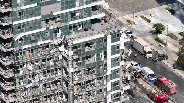 Aerial view Ramat Gan Iranian missile strike destruction Israel

Drone footage showing heavy structural damage from missile impact in Ramat Gan Israel June 13 2025
