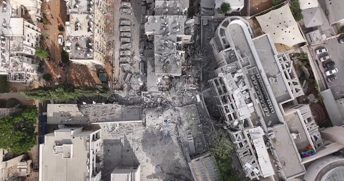 Aerial view Ramat Gan Iranian missile strike destruction Israel

Drone footage showing heavy structural damage from missile impact in Ramat Gan Israel June 13 2025
