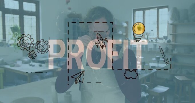 Fixing aproned maker checking cup fixing mask in studio as PROFIT overlay fading in partner hugging