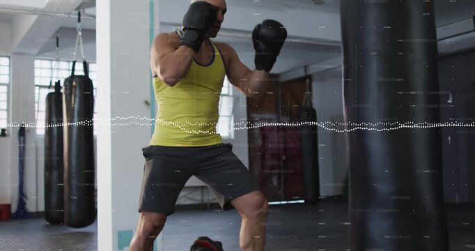 Male boxer raising gloves jabbing and crossing heavy bag training moving feet waveform showing hits