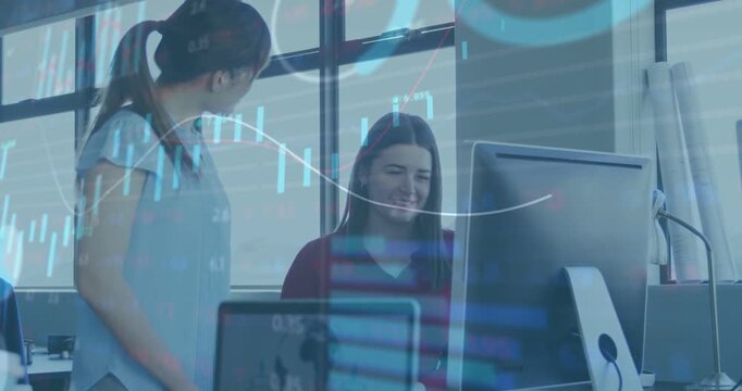 Standing woman leaning in and pointing at screen, starting finance review of candles bars trendline