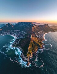 Naklejka premium Aerial view of Table Mountain and Cape Town coastline at sunset.