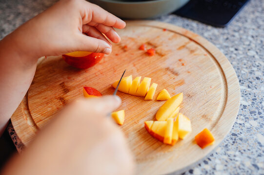 Close up of sliced fruit on cutting board, fresh, healthy eating.