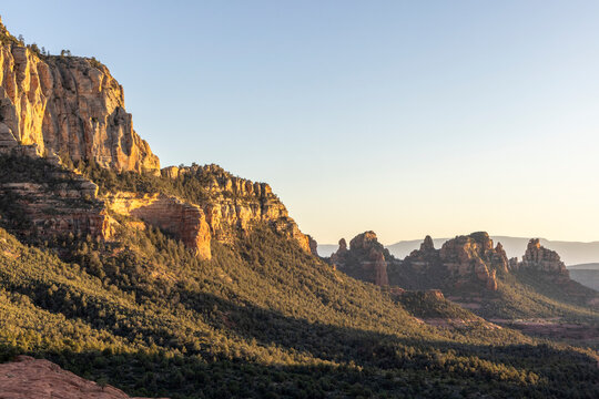 Forested rugged rock formations in sedona landscape