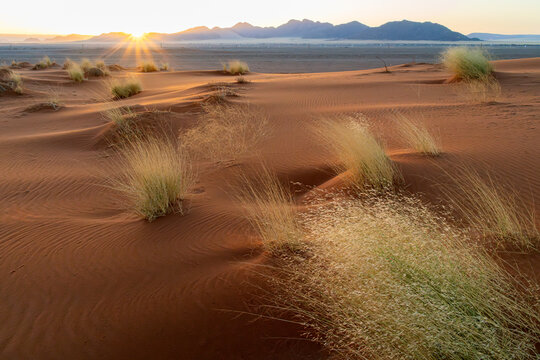 Sunrise over mountains and dunes in Namibia