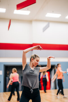 Woman enjoying dance fitness class at studio
