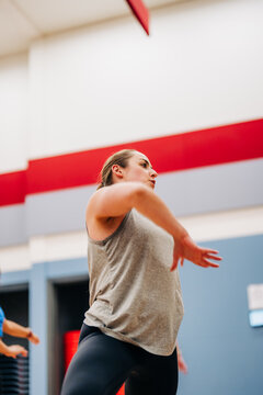 Woman actively exercising during a dynamic fitness workout