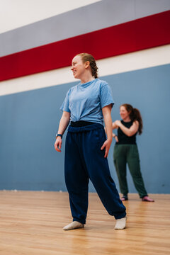 Young women having fun dancing in studio