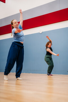 Dancers rehearsing expressive contemporary movement in studio