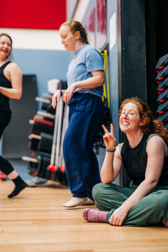 Happy women taking a break during exercise class