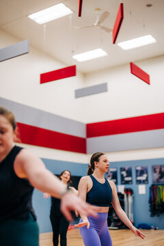 Women attending fitness class for wellness and exercise