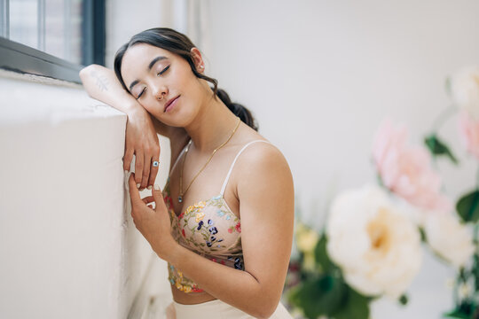 Woman with eyes closed finding peace and serenity