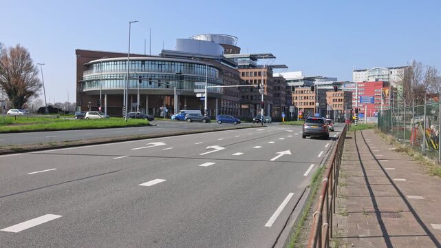 Modern architecture of the Ahold Delhaize head office in Zaandam, Netherlands. Urban street view with traffic and contemporary office buildings. Zaandam, Netherlands. 22 March 2026.