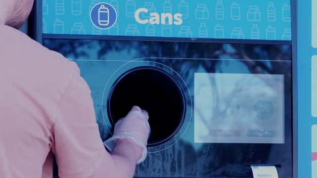 Slow motion rear view of man inserting cans into recycling return machine sustainability concep