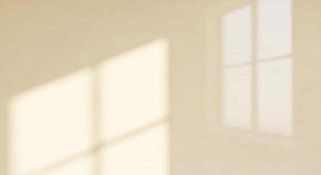 Soft Sunlight Casting Geometric Shadows on a Plain Wall.