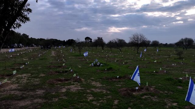 Aerial Israeli flags Nova memorial site Reim Israel

Drone footage Israeli flags memorial graves Nova festival site Reim Israel October 7 2025
