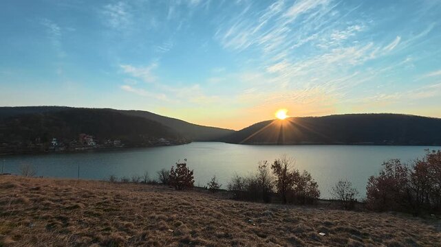 Sunset Over Autumn Lake &ndash; Blue Water and Sun Rays Behind Hills. Location: Bovan Lake. Balkans, Serbia.