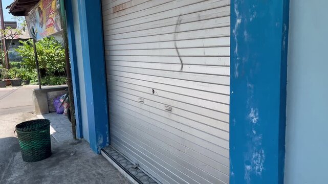 Closed Metal Shutter of a Business Storefront
