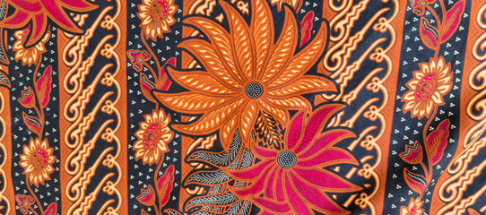 background motif of traditional batik fabric from Indonesia © Dwi