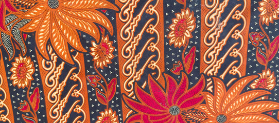 background motif of traditional batik fabric from Indonesia © Dwi