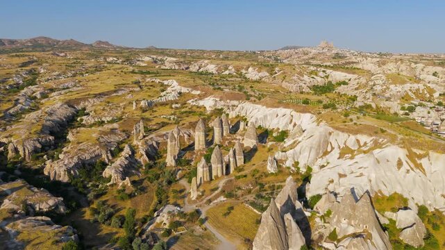 Goreme, Nevsehir, Turkey. Drone view of the distinctive phallic rock pillars and eroded formations that define the landscape of Gorkundere Valley.. Aerial View, MasterShots, Circle (Far)