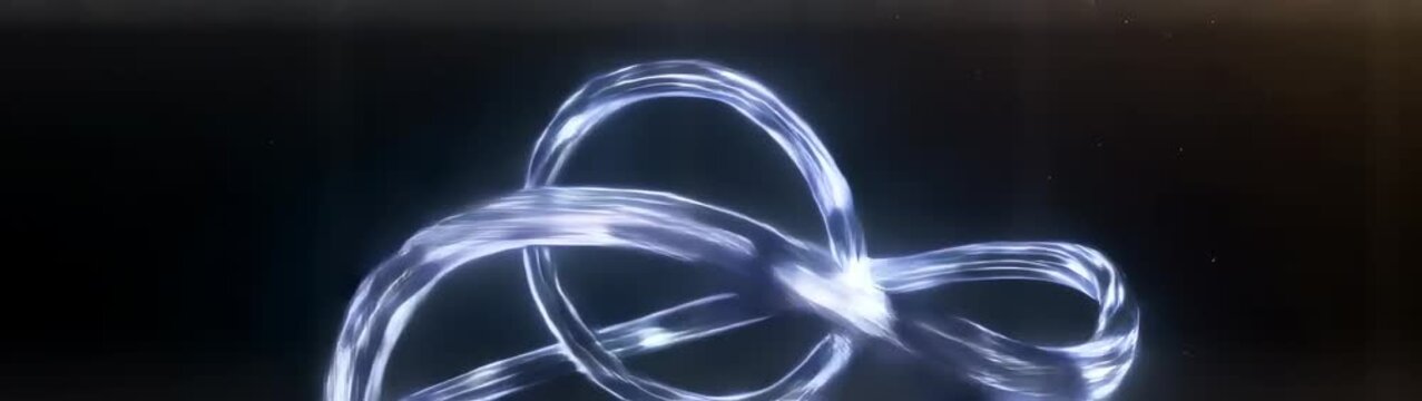 A blue light illuminates a long curved wire