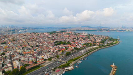 Fototapeta premium Istanbul, Turkey. Bosphorus embankment. Historical city center. Fatih district. Cloudy weather at sunset, Aerial View