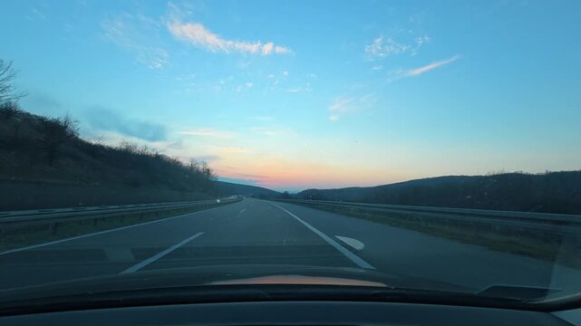 POV Driving on Empty Highway at Dusk &ndash; Blue and Purple Sky
