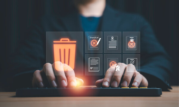 Data management concept with hand deleting digital files and documents showing data cleanup, file removal, privacy protection, information management and secure document disposal business technology.