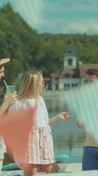 Vibrant gathering at waterfront locale, Joyful assembly with colorful decorations and cheerful chatter