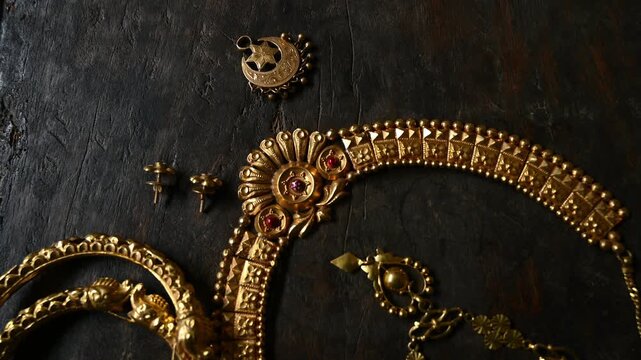 Gold prices in India are significant as an economic indicator and cultural cornerstone. As the largest consumer, the rising prices of old, vintage, expensive Indian-style gold jewelry. shiny necklace.