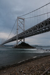 Obraz premium Dramatic Bridge View Across Coastal Waters