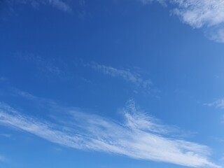 Fototapeta premium Clear blue sky with soft clouds, summer weather background, copy space