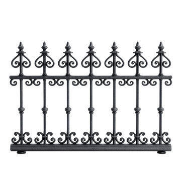 Wrought iron garden fence decorative ornamental scrollwork vintage black metal railing with spear finial and curly pattern on dark backdrop