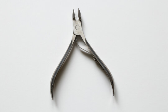 Cuticle and hangnail nippers on a white background for nail care, skin care
