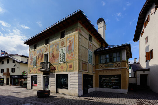 Cortina d'Ampezzo, Belluno, Italy - March 22 2026: Ciasa dei pupe Historic Bulding in Cortina d'Ampezzo, formerly the Hotel Aquila Nera on the Corso Italia with Famous Frescoes by Luigi and Giuseppe G