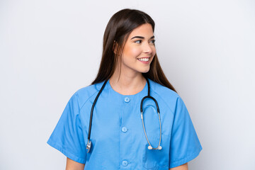 Young Brazilian nurse woman isolated on white background looking side