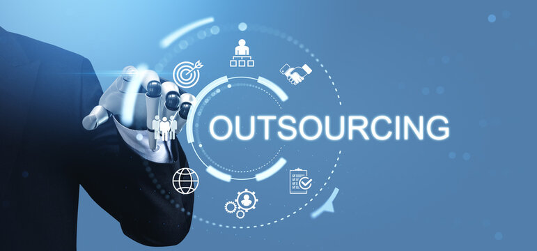 Robotic hand interacting with digital outsourcing interface surrounded by futuristic business icons in a blue technological environment illustrating modern workflow concept.
