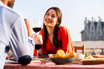 Obraz premium Multiracial beautiful happy couple of lovers dating in Barcelona on a rooftop with amazing city view