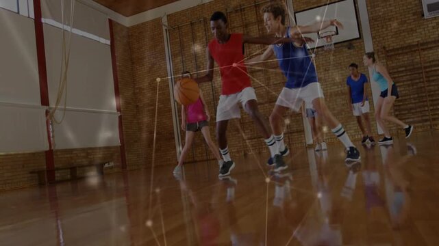Red-shirted ball-handler gaining possession and dribbling, shielding ball to evade close defender