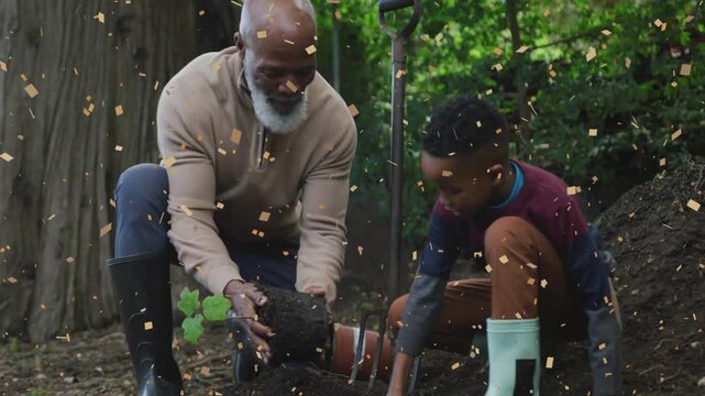 Grandpa lifting rootball guiding child planting sapling garden tamping soil confetti overlay hands