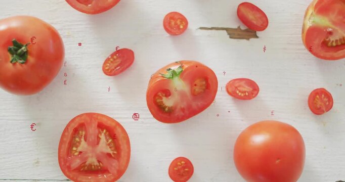 Displaying halved tomato with green calyx amid whole tomatoes on white board, red symbols drifting