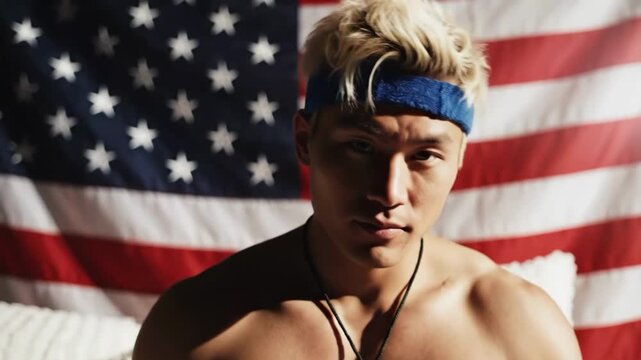 Man relaxing in front of a large american flag