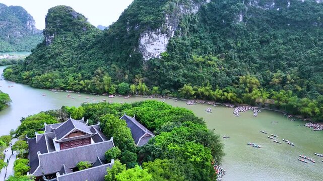 Aerial view of Trang An scenic area with boat cave tours near Ninh Binh, Vietnam