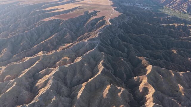 Drone footage capturing the breathtaking badlands and gullies of the Gorafe desert. This arid landscape in Andalusia offers a unique view