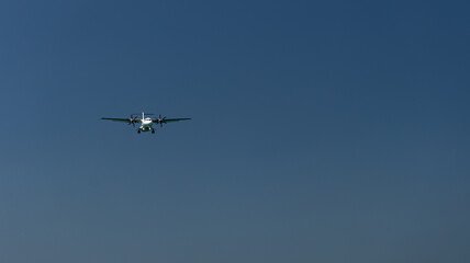 Fototapeta premium The plane is landing over the sea