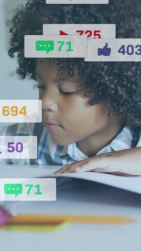Vertical video: Pupil reading homework at desk, bell appearing and causing floating icons over page