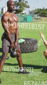 Vertical video: Coach cueing, athlete lifting kettlebell on field for strength, metrics overlaying